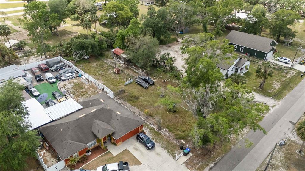 3rd Ave Avenue Orlando, FL 32820 - Photo 7 of 15 an aerial view of a house with a yard