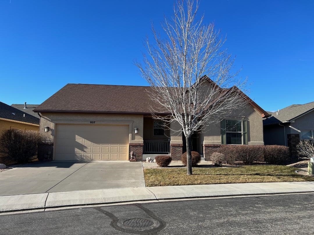 607 Eldorado Drive Grand Junction, CO 81505 - Photo 1 of 32 a front view of a house with a yard