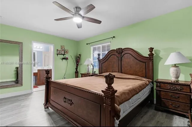 a bed room with a bed and a chandelier