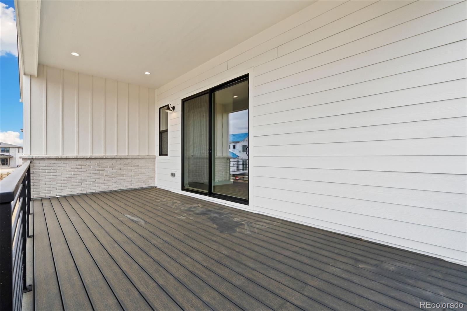 5841 Gianna Drive Timnath, CO 80547 - Photo 15 of 15 a view of an empty room with wooden floor and a window