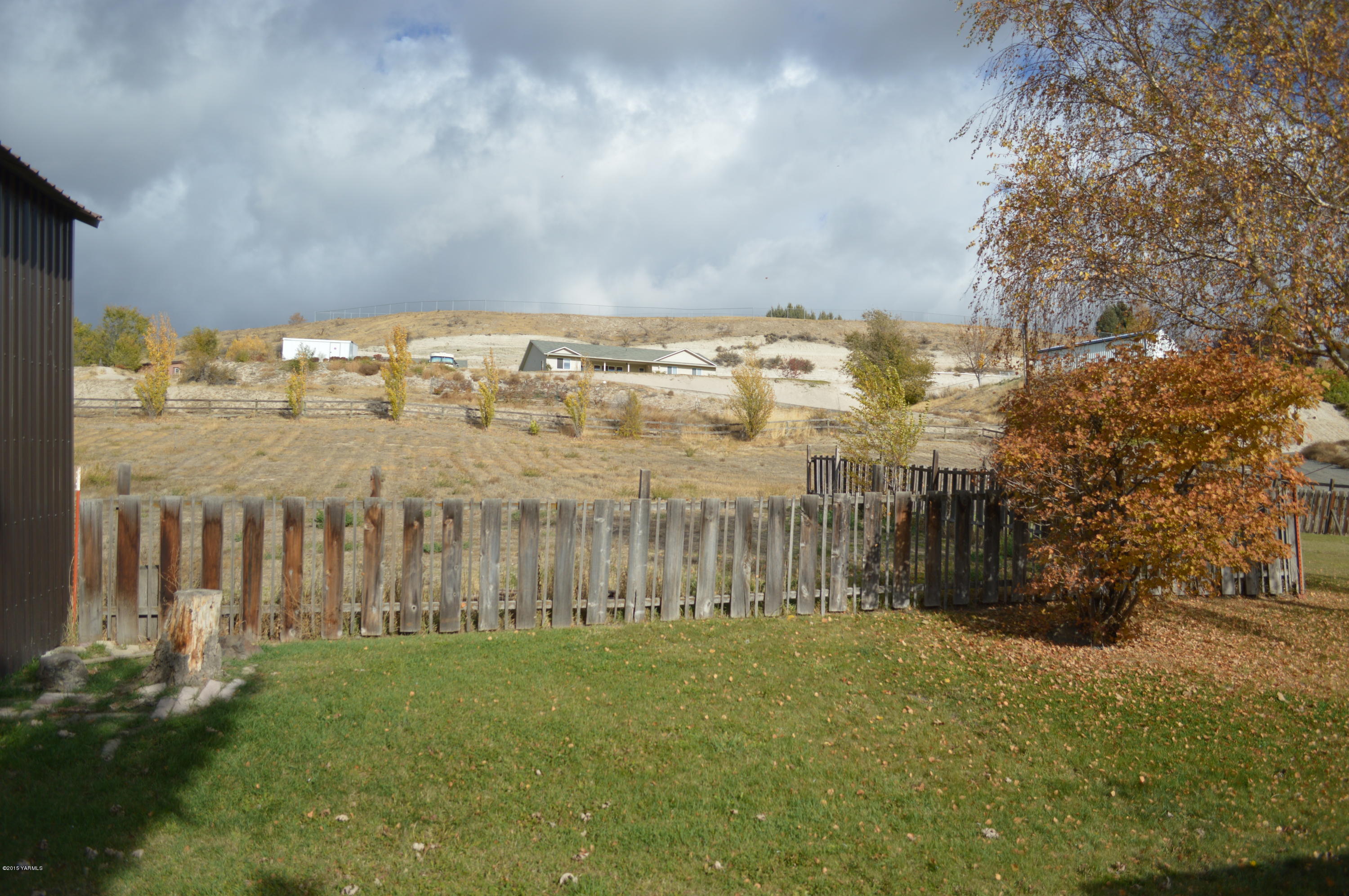 781 Collins Road Selah, WA 98942 - Photo 17 of 23 a view of a city with tall trees