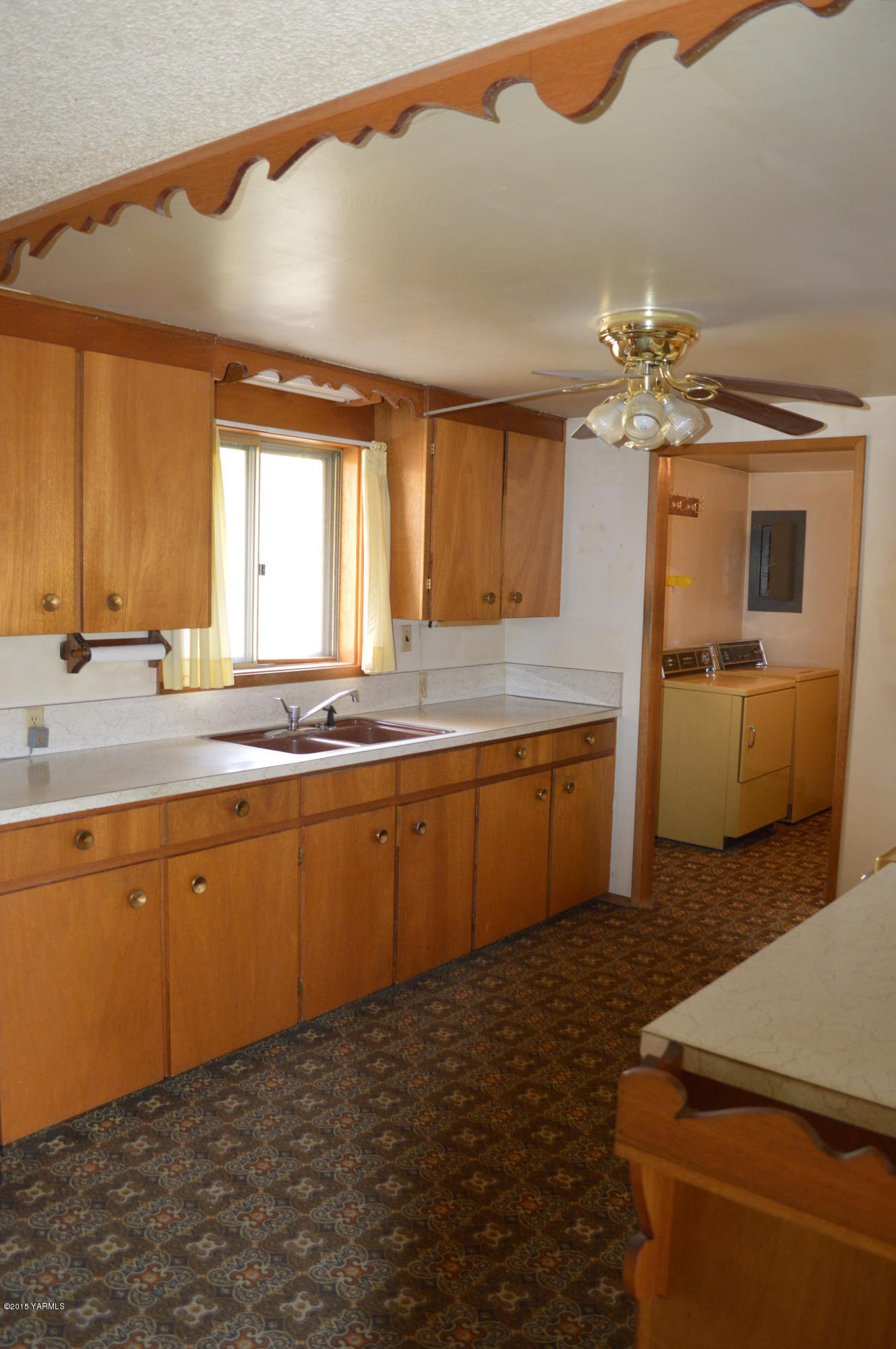 781 Collins Road Selah, WA 98942 - Photo 6 of 23 a kitchen with a sink cabinets and window
