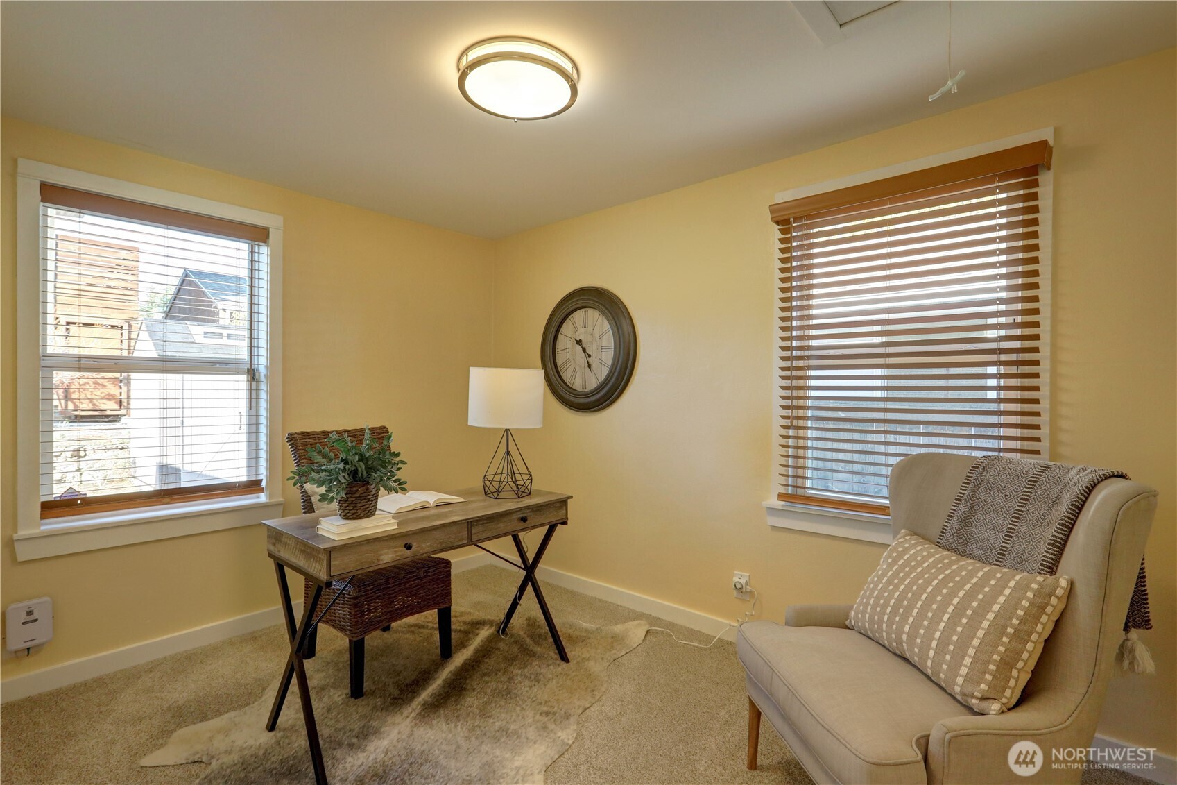7943 31st Avenue Southwest Seattle, WA 98126 - Photo 12 of 16 a living room with furniture and a window