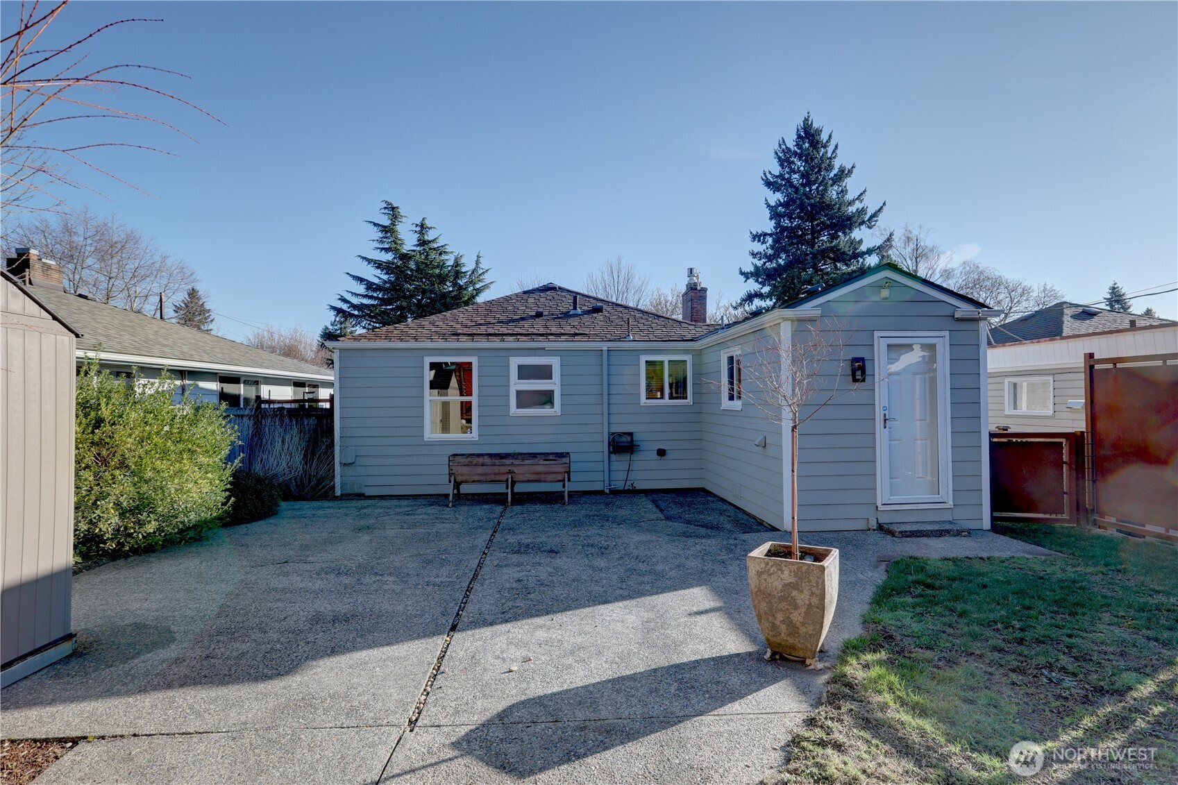 7943 31st Avenue Southwest Seattle, WA 98126 - Photo 14 of 16 a front view of a house with a garden