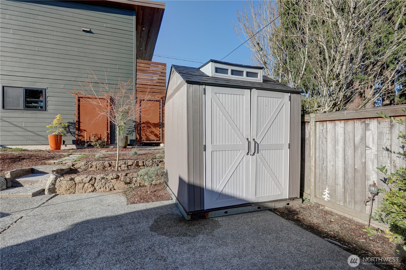 7943 31st Avenue Southwest Seattle, WA 98126 - Photo 16 of 16 a view of a house with a yard