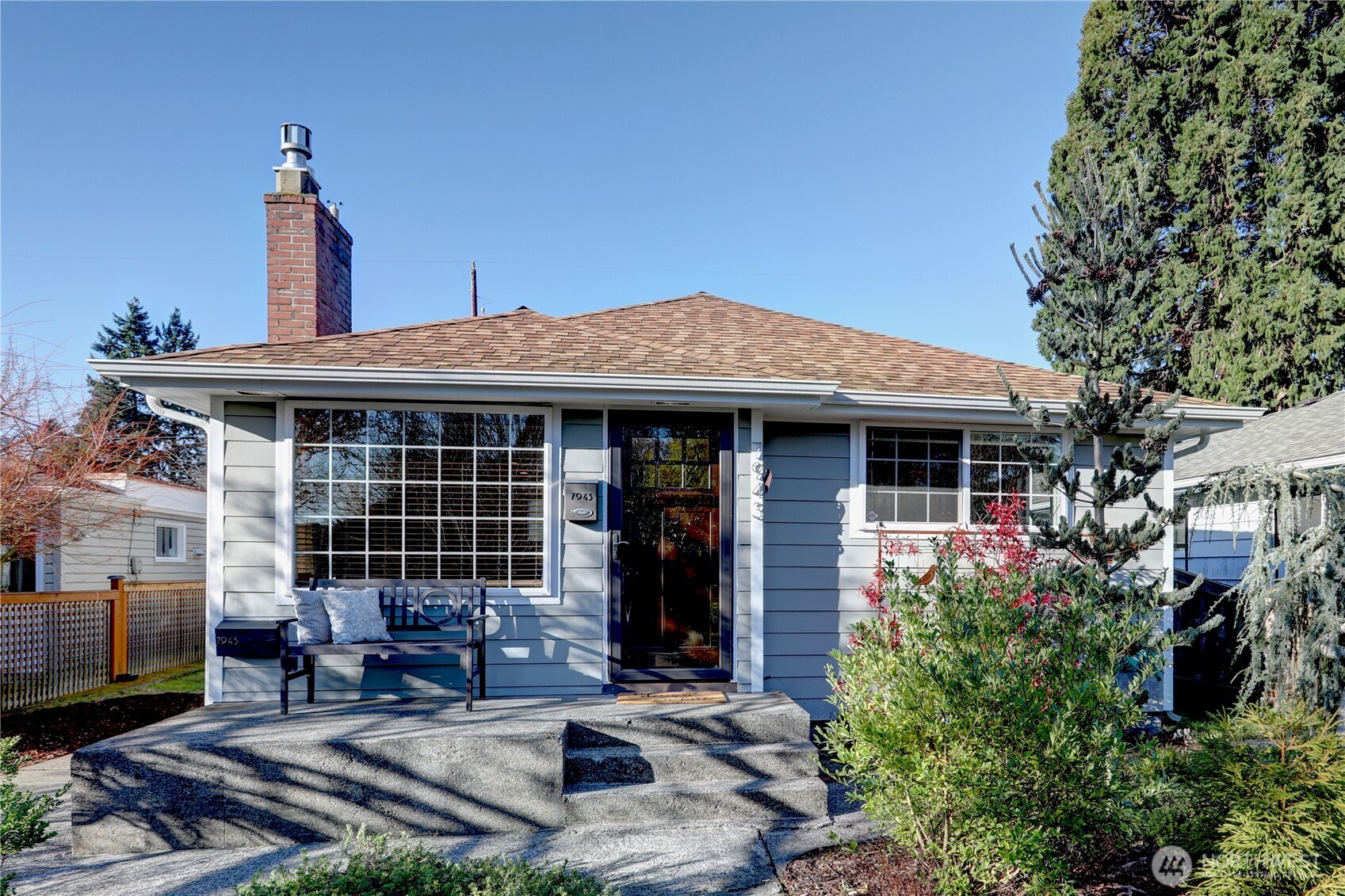 7943 31st Avenue Southwest Seattle, WA 98126 - Photo 3 of 16 a front view of a house with patio