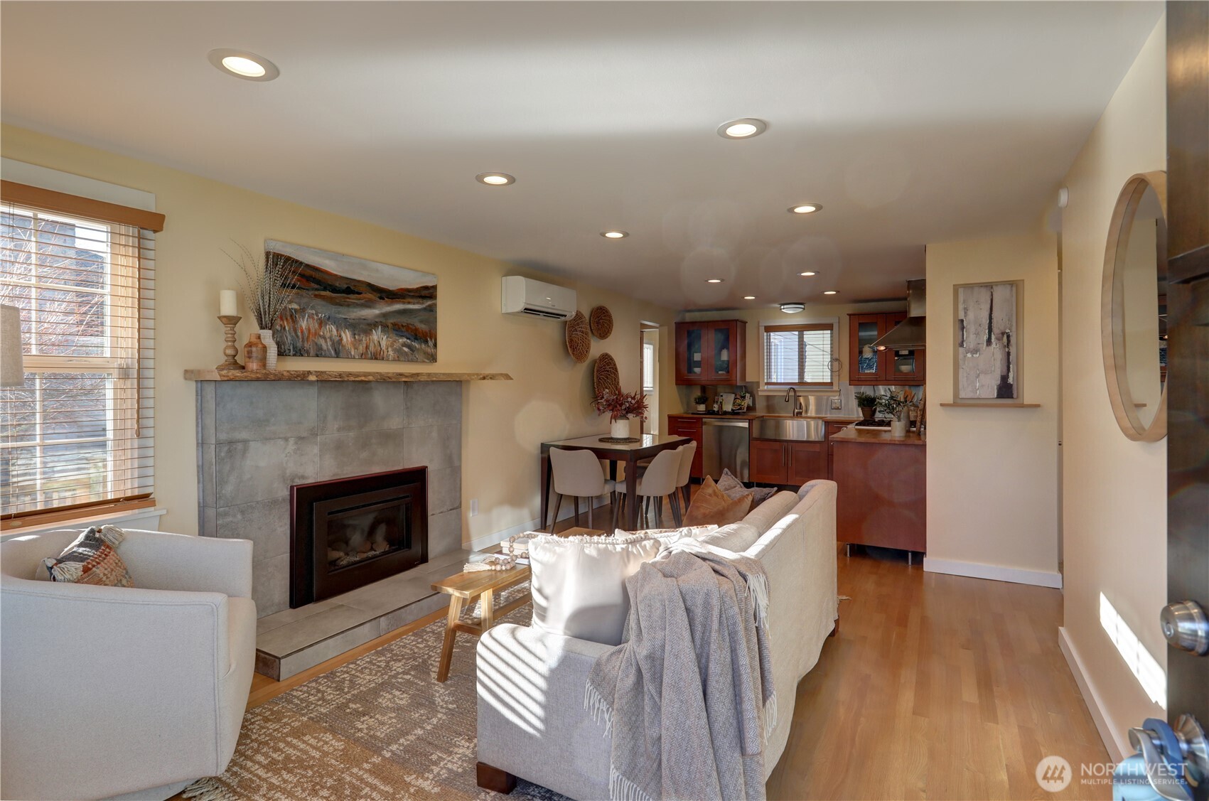 7943 31st Avenue Southwest Seattle, WA 98126 - Photo 4 of 16 a living room with furniture and a fireplace