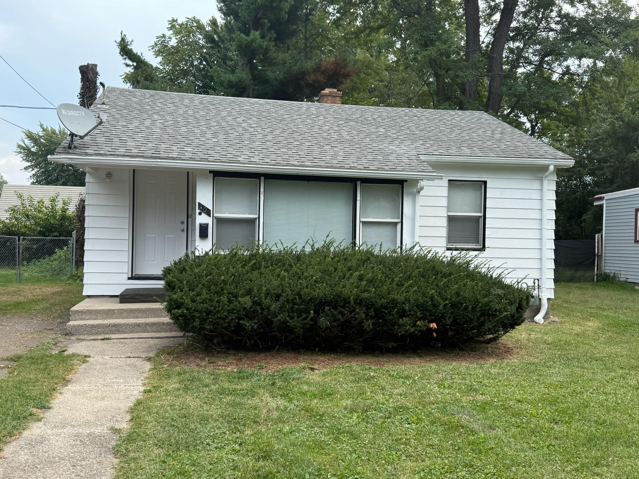 a view of a house with a garden