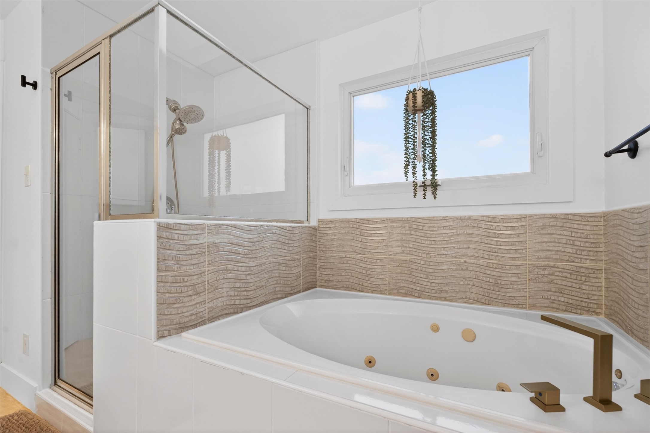 2716 Bagby Street Houston, TX 77006 - Photo 19 of 29 a bathroom with a tub and a shower