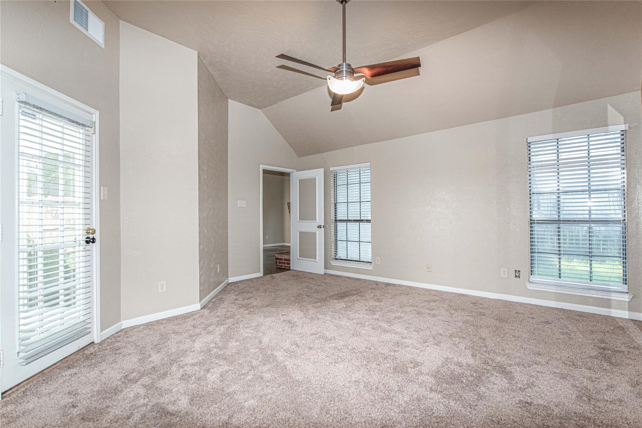 10131 Wayward Wind Lane Houston, TX 77064 - Photo 10 of 16 a view of an empty room with a window