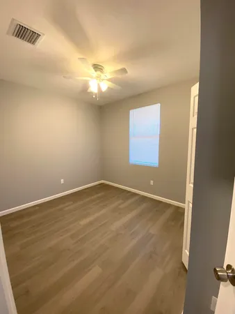 an empty room with a empty space and a window
