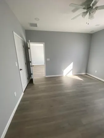 a view of a hallway with staircase
