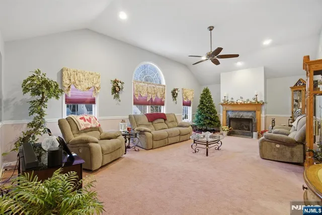 a living room with furniture fireplace and a chandelier