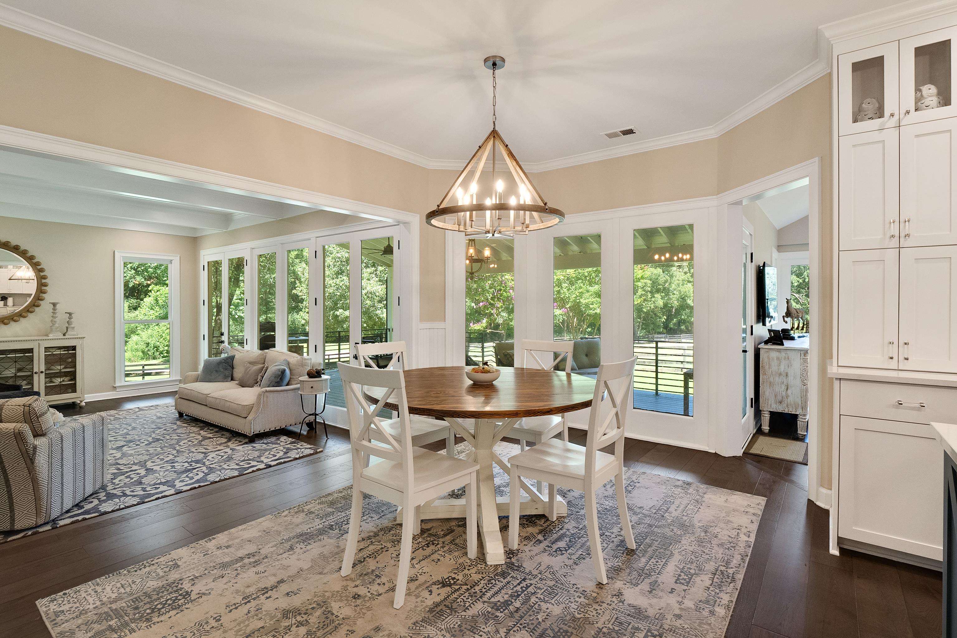 11830 Monterey Road Eads, TN 38028 - Photo 12 of 40 Dining space featuring dark wood-type flooring, a chandelier, and ornamental molding