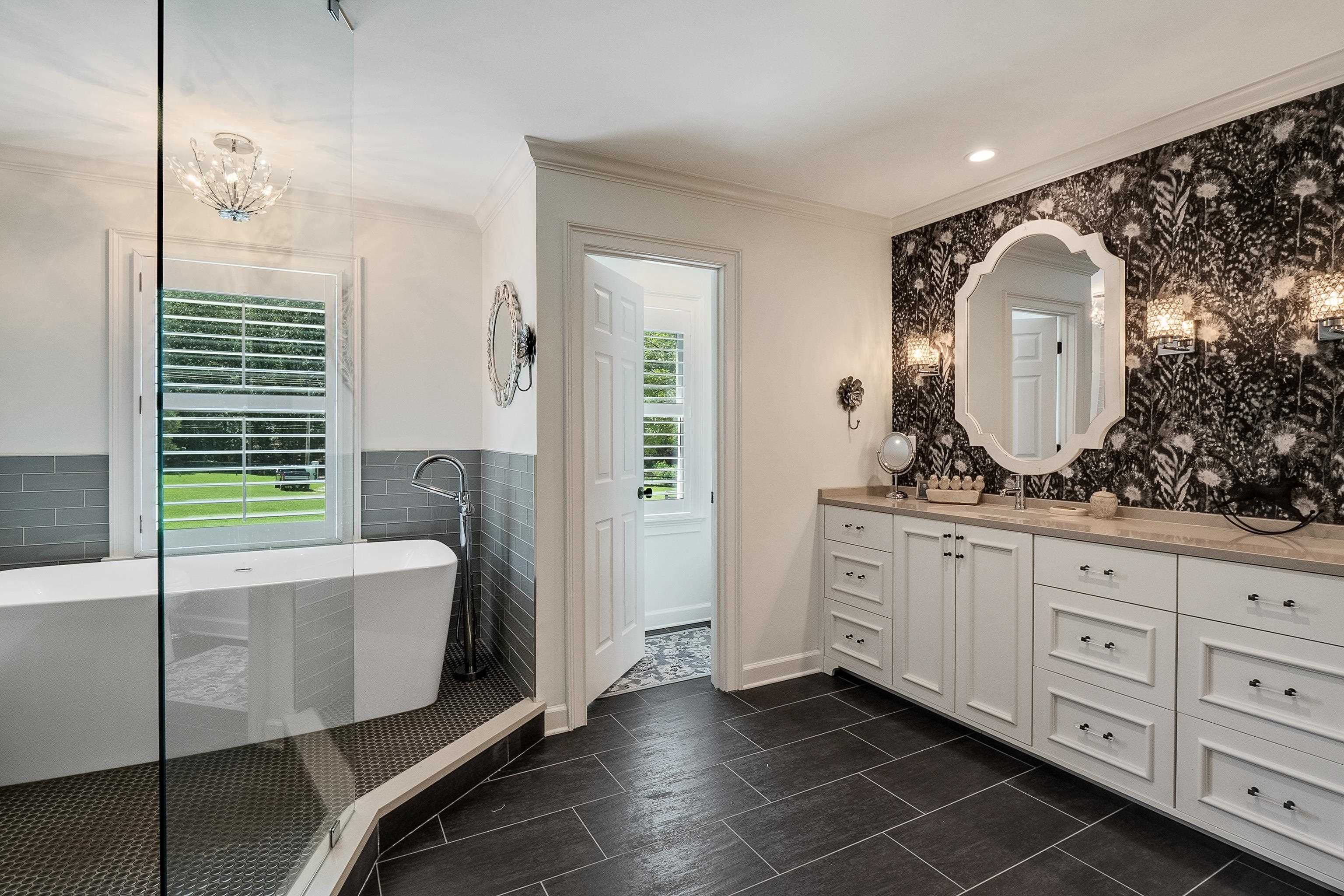 11830 Monterey Road Eads, TN 38028 - Photo 21 of 40 Bathroom with vanity, tiled tub, and tile patterned flooring
