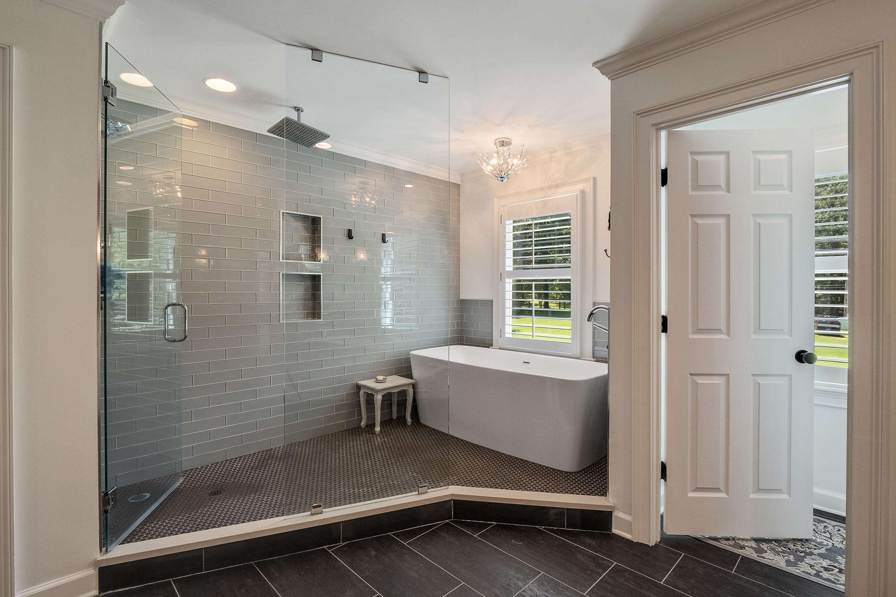 11830 Monterey Road Eads, TN 38028 - Photo 22 of 40 Bathroom featuring crown molding, tile patterned floors, plus walk in shower, and an inviting chandelier