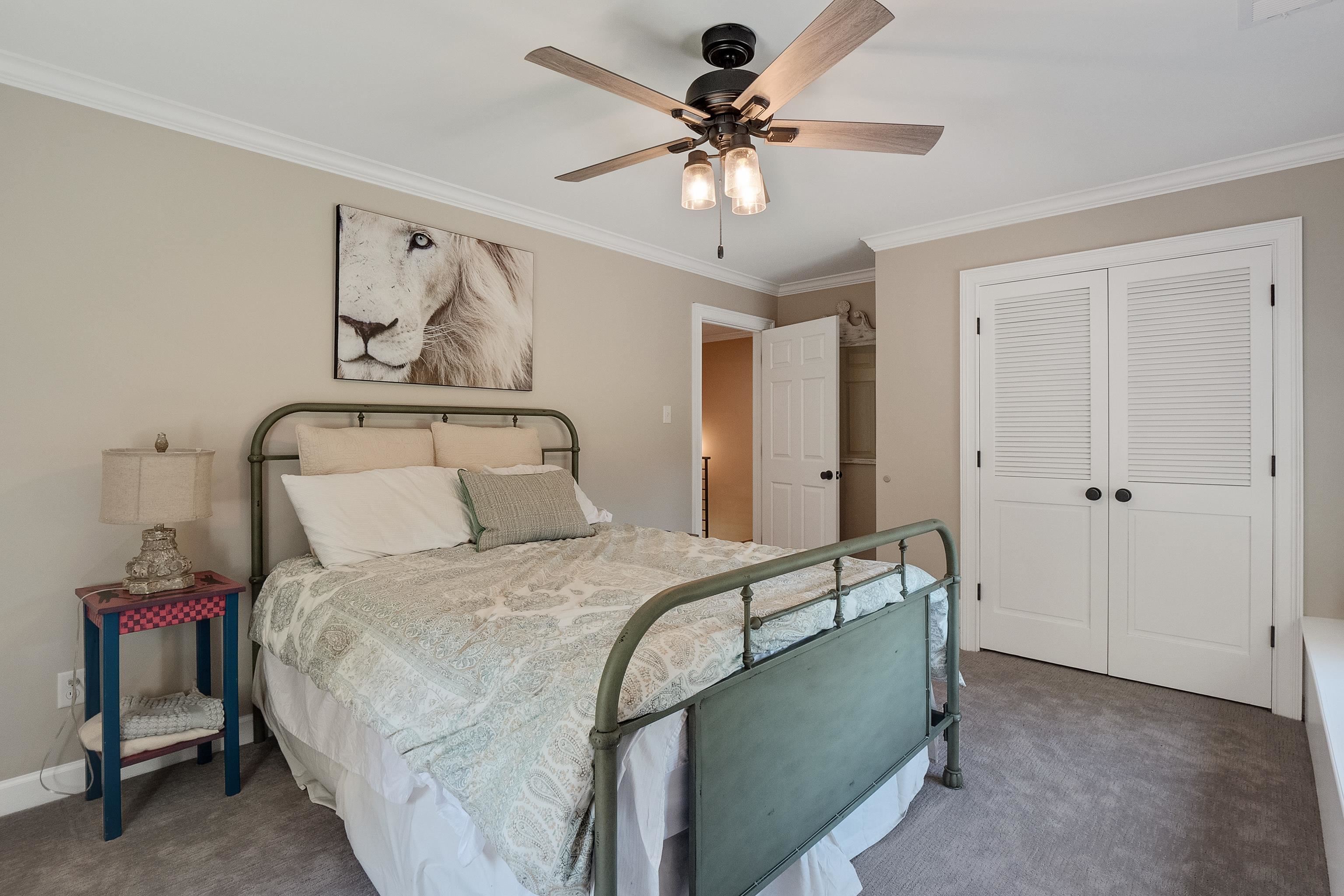 11830 Monterey Road Eads, TN 38028 - Photo 24 of 40 Bedroom featuring a closet, ceiling fan, crown molding, and dark carpet