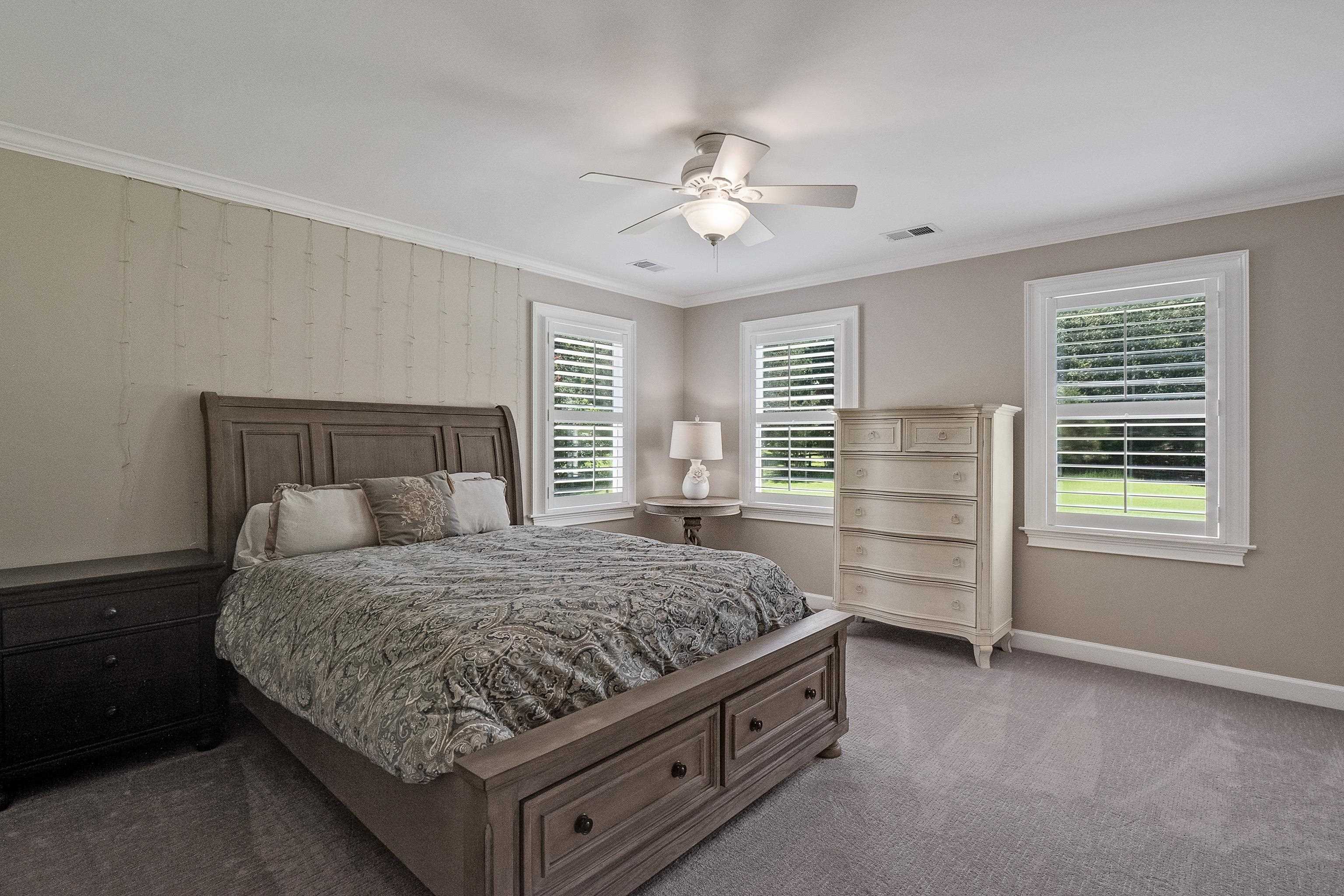 11830 Monterey Road Eads, TN 38028 - Photo 27 of 40 Carpeted bedroom featuring crown molding and ceiling fan