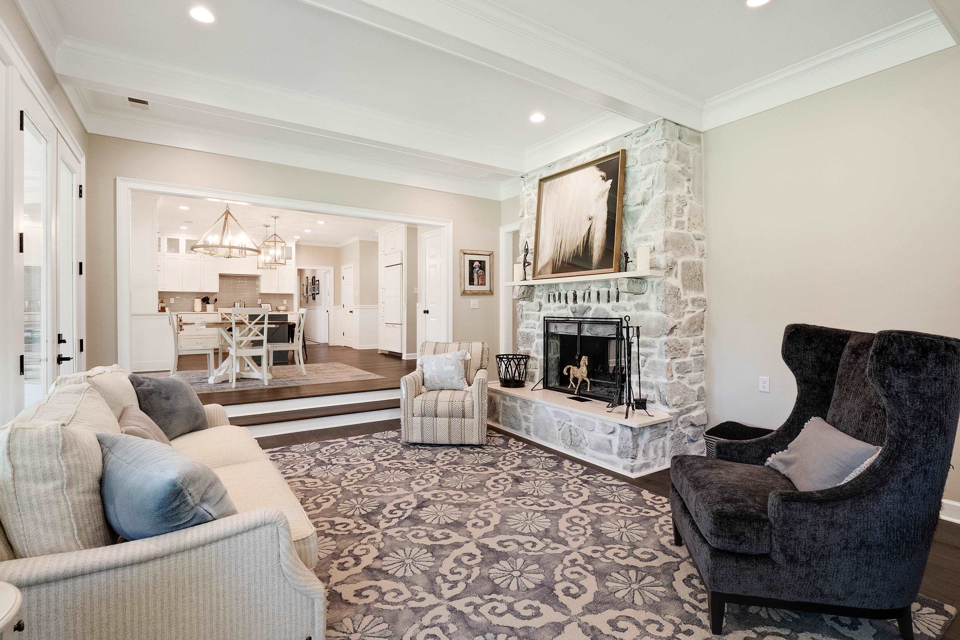11830 Monterey Road Eads, TN 38028 - Photo 6 of 40 Living room featuring a fireplace, crown molding, hardwood / wood-style floors, and beam ceiling