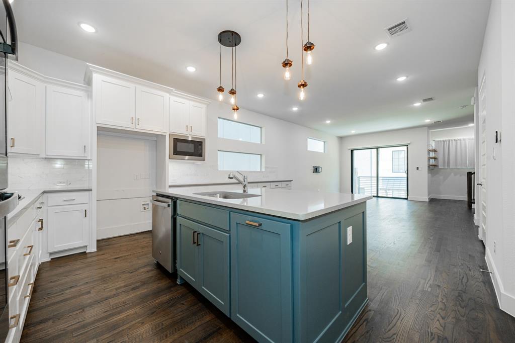 8106 Fallston Court Dallas, TX 75231 - Photo 19 of 40 a kitchen with a sink stainless steel appliances and cabinets