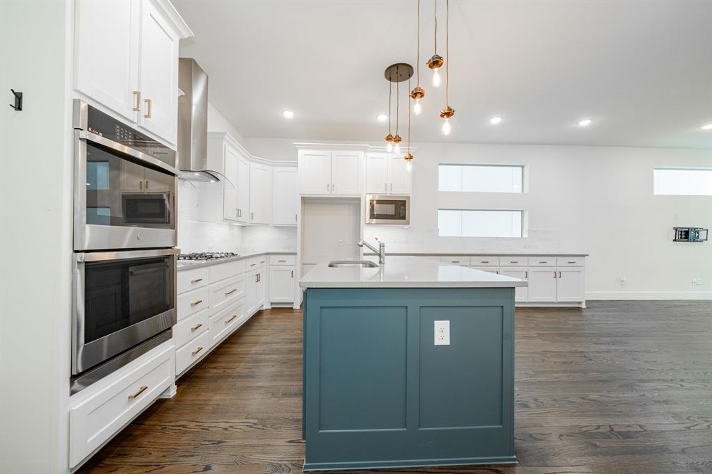 8106 Fallston Court Dallas, TX 75231 - Photo 20 of 40 a kitchen with stainless steel appliances granite countertop a sink a stove and a refrigerator