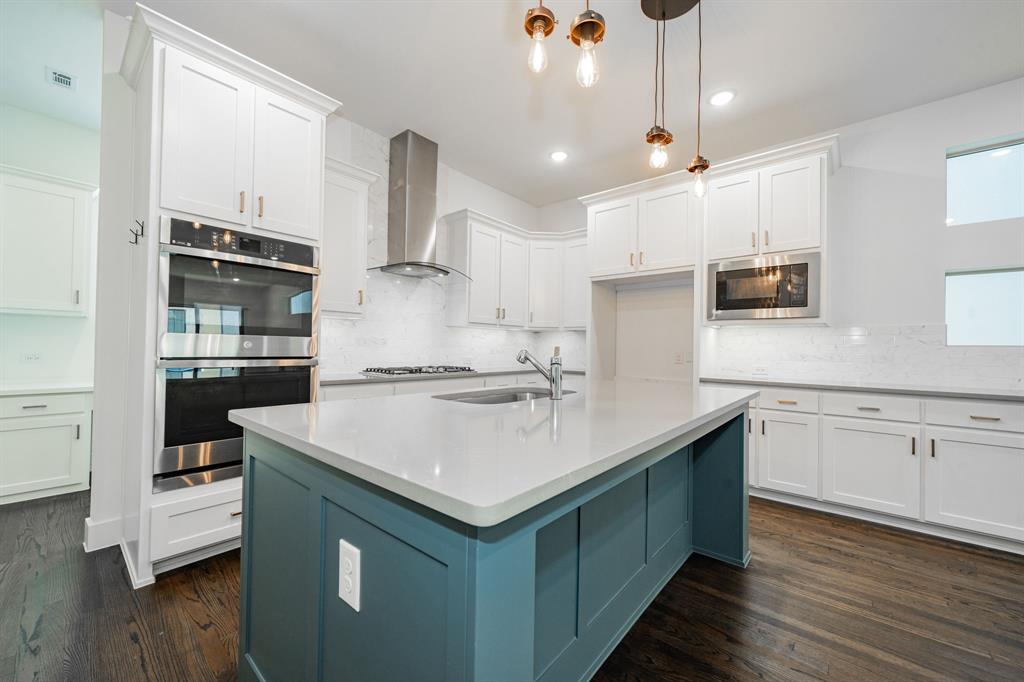 8106 Fallston Court Dallas, TX 75231 - Photo 21 of 40 a kitchen with granite countertop a sink and cabinets