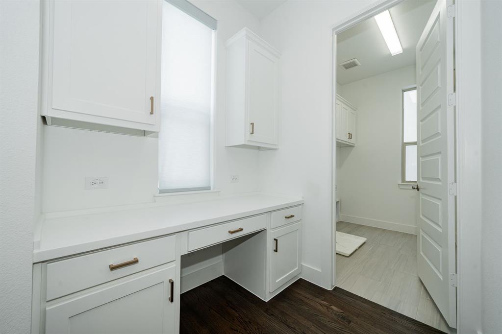 8106 Fallston Court Dallas, TX 75231 - Photo 23 of 40 a room with a sink and cabinets