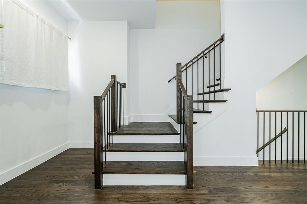 8106 Fallston Court Dallas, TX 75231 - Photo 24 of 40 a view of entryway and hall with wooden floor