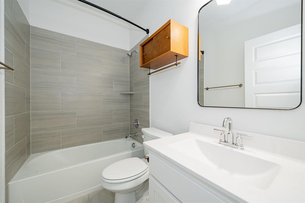 8106 Fallston Court Dallas, TX 75231 - Photo 33 of 40 a bathroom with a sink toilet and shower