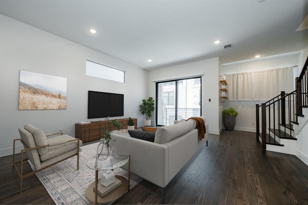 8106 Fallston Court Dallas, TX 75231 - Photo 9 of 40 a living room with furniture and a flat screen tv with wooden floor