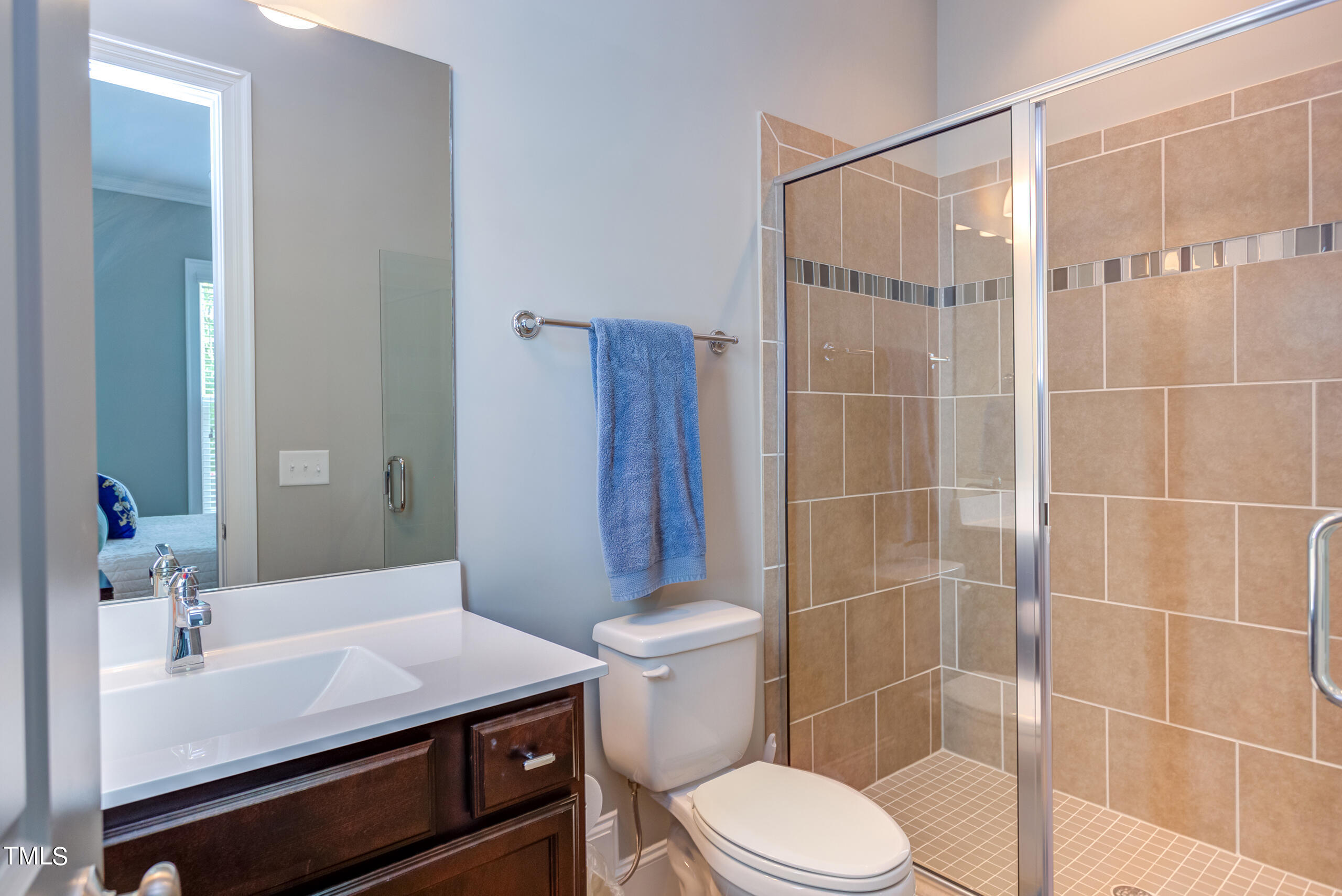 6426 Rosny Road Raleigh, NC 27613 - Photo 23 of 51 a bathroom with a sink toilet and shower