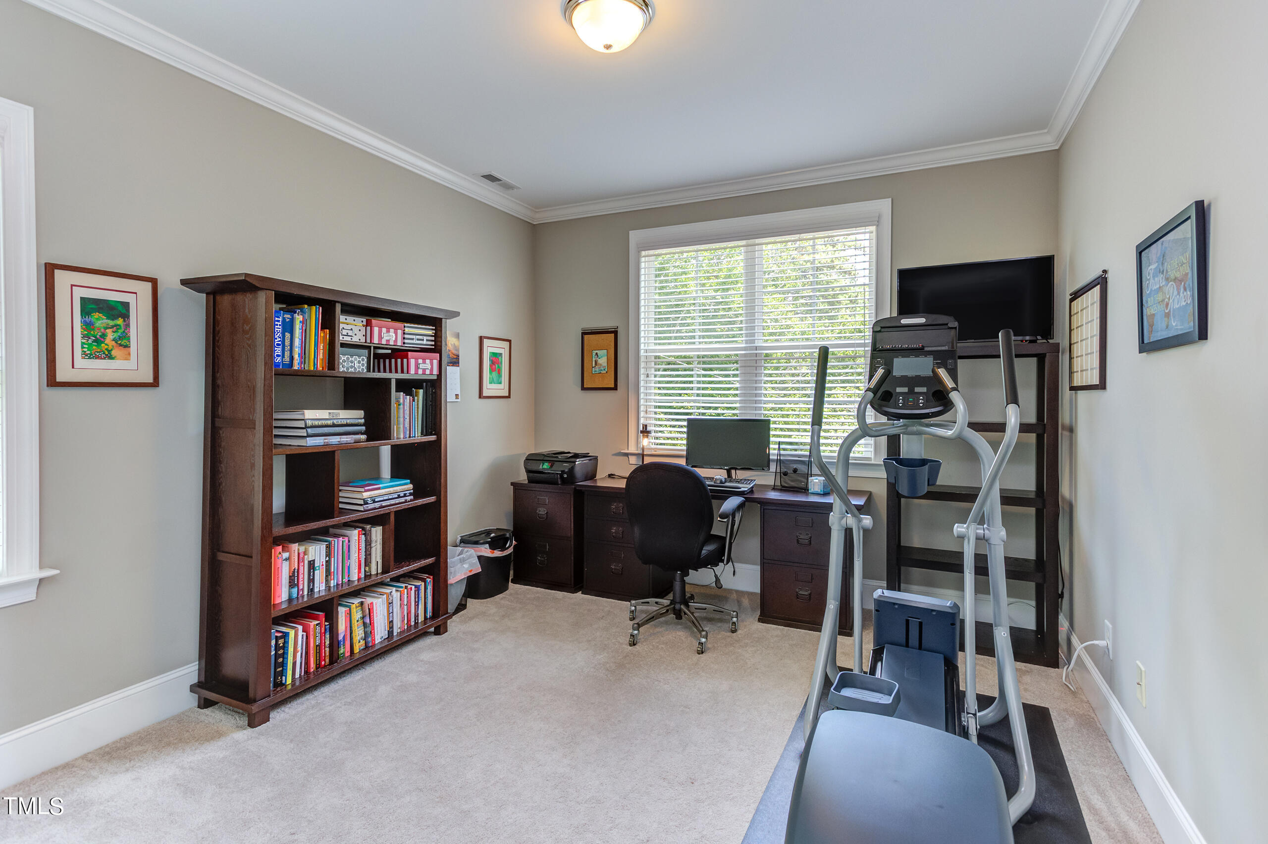 6426 Rosny Road Raleigh, NC 27613 - Photo 35 of 51 a view of a livingroom with workspace and a window