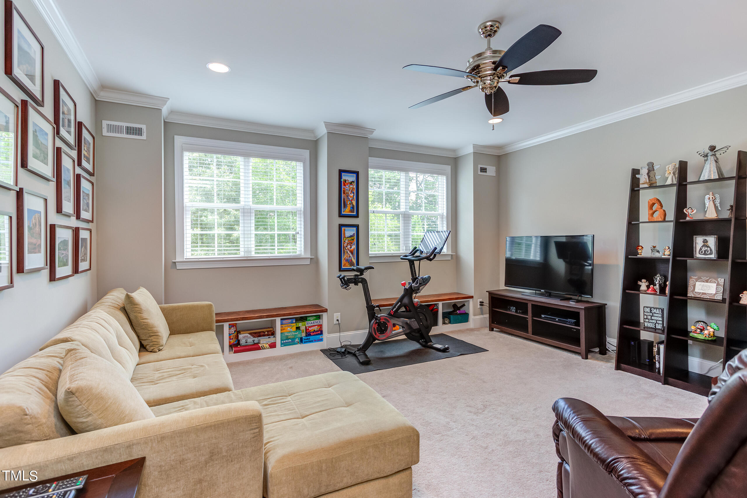 6426 Rosny Road Raleigh, NC 27613 - Photo 38 of 51 a living room with furniture workspace and a flat screen tv