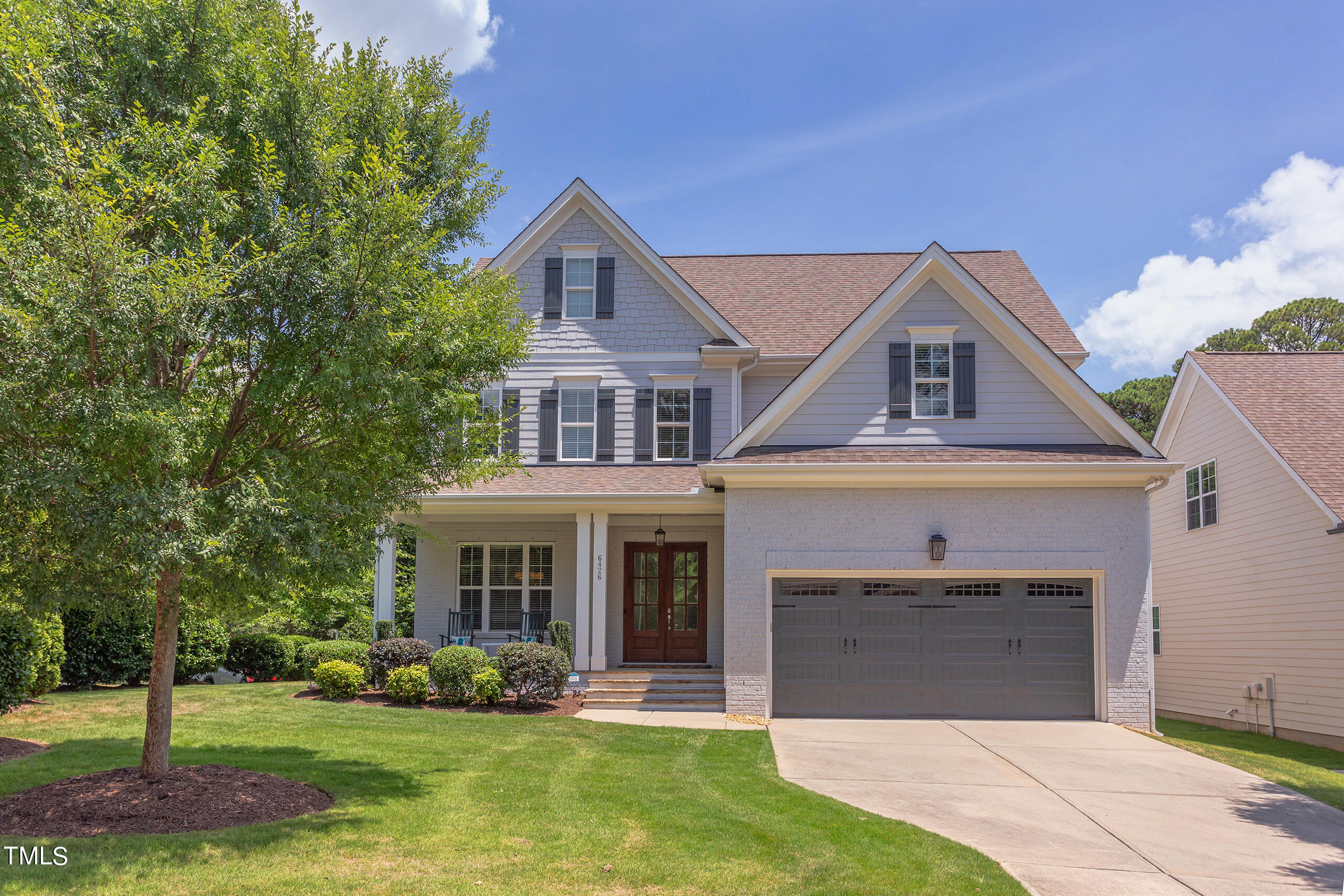 6426 Rosny Road Raleigh, NC 27613 - Photo 4 of 51 a front view of a house with a yard and garage