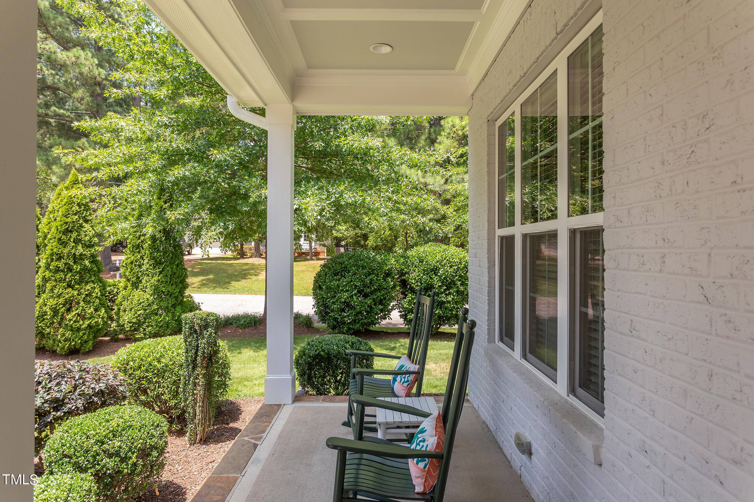 6426 Rosny Road Raleigh, NC 27613 - Photo 6 of 51 a view of a room with a large window and wooden floor