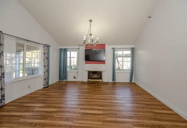 a bedroom with a bed and a fireplace