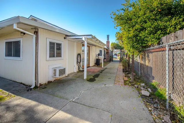 a view of a pathway with a house in the background