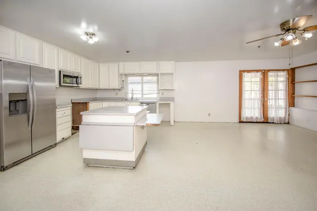 a view of a kitchen with appliances and cabinets