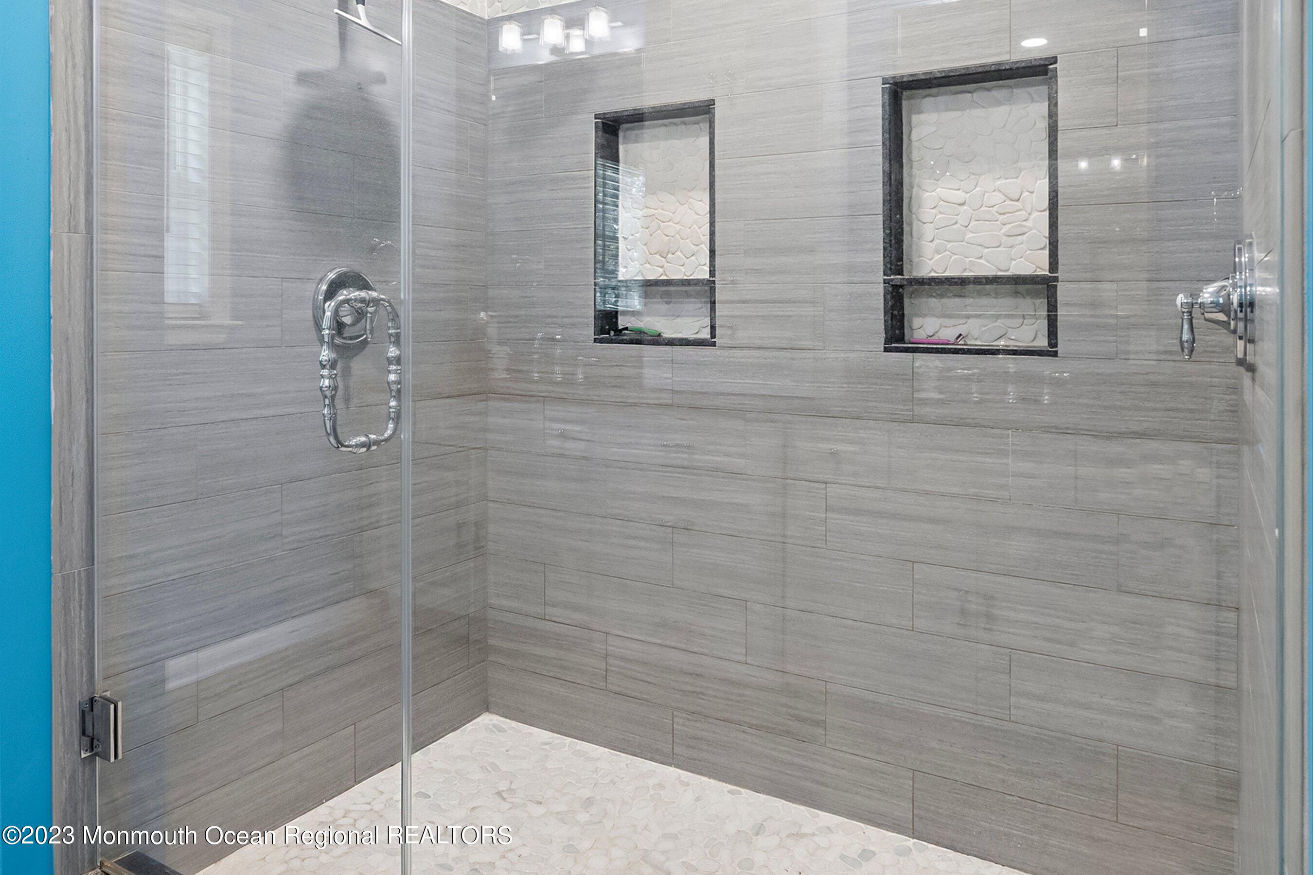 3 Adams Court Howell, NJ 07731 - Photo 14 of 36 a bathroom with a shower