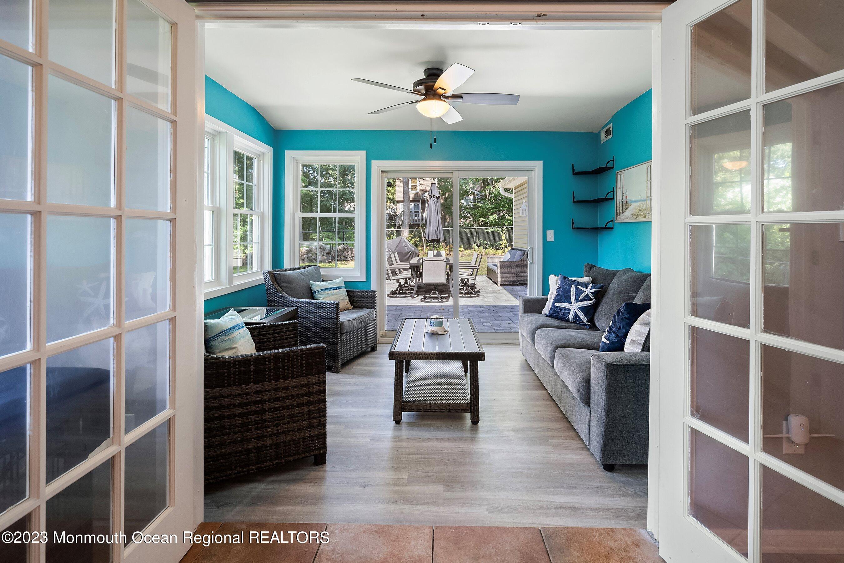 3 Adams Court Howell, NJ 07731 - Photo 29 of 36 a living room with furniture large window and outer view