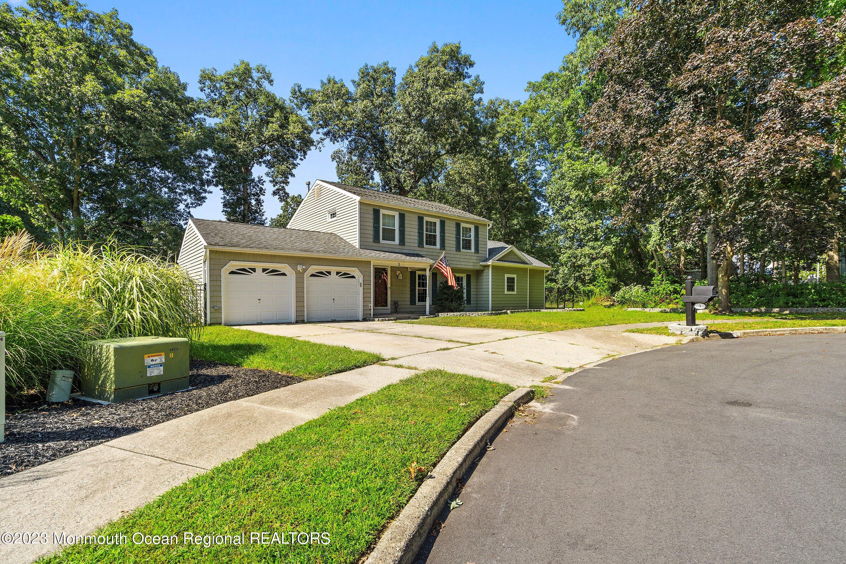 3 Adams Court Howell, NJ 07731 - Photo 3 of 36 a view of a house with a big yard and large trees
