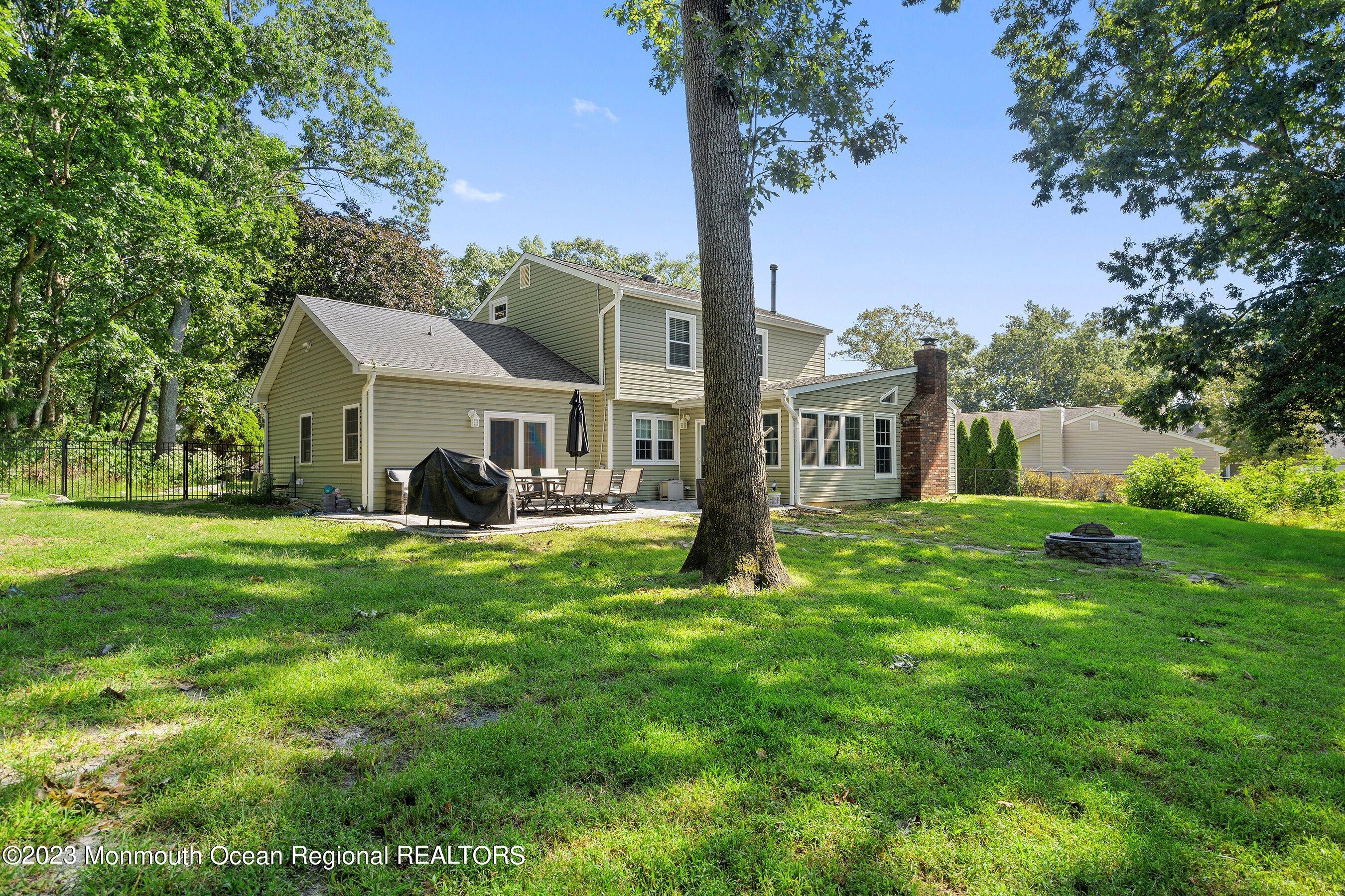 3 Adams Court Howell, NJ 07731 - Photo 34 of 36 a front view of a house with a garden