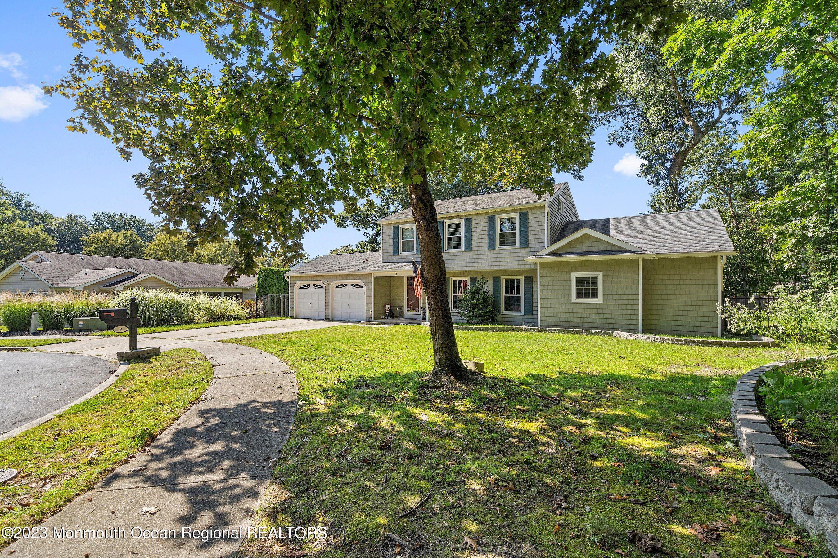 3 Adams Court Howell, NJ 07731 - Photo 4 of 36 a front view of a house with a yard