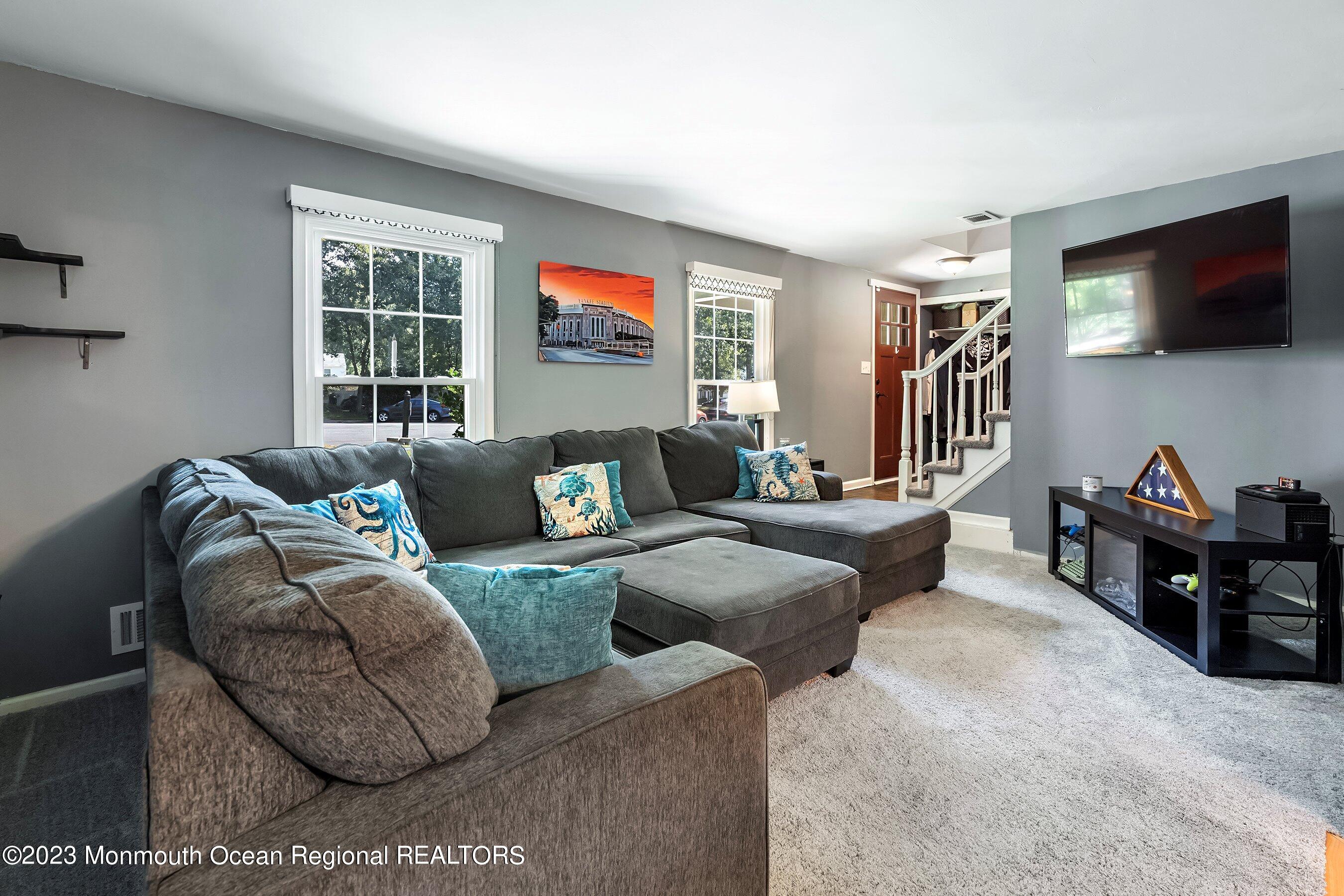3 Adams Court Howell, NJ 07731 - Photo 7 of 36 a living room with furniture and a flat screen tv
