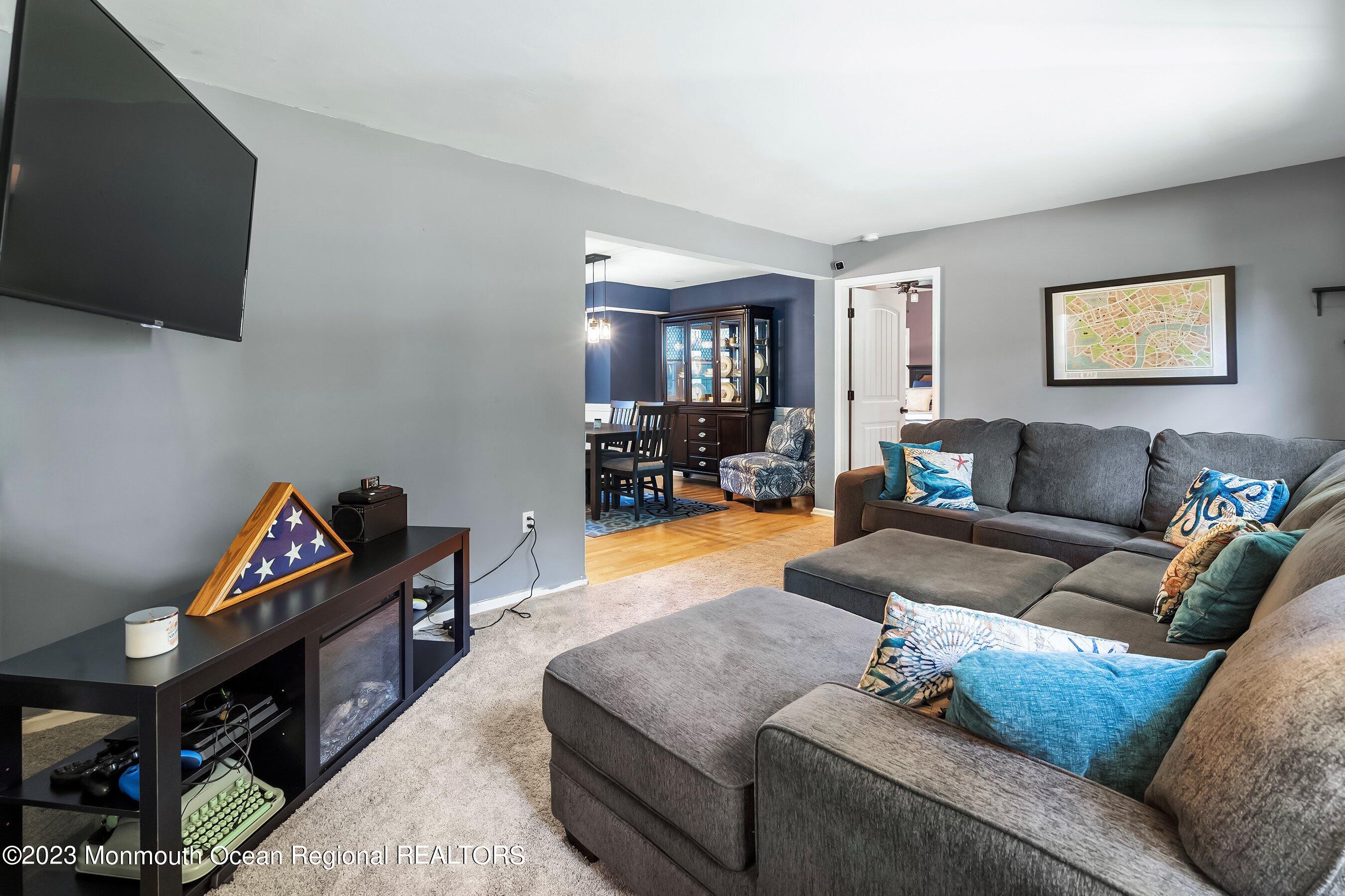 3 Adams Court Howell, NJ 07731 - Photo 8 of 36 a living room with furniture and a flat screen tv