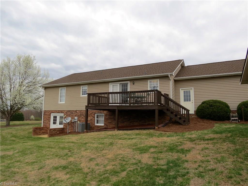 640 Moir Mill Road Eden, NC 27288 - Photo 18 of 19 Rear view with basement exterior entrance and the large deck that is great for cookouts.