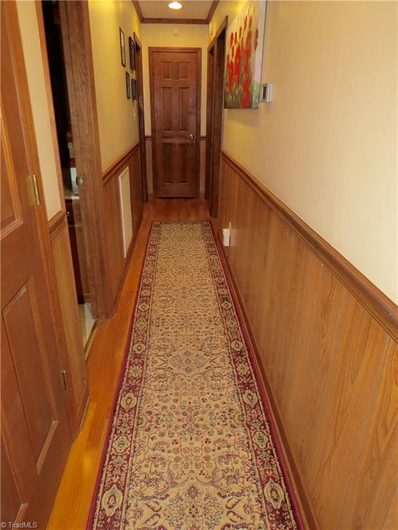 640 Moir Mill Road Eden, NC 27288 - Photo 8 of 19 Hallway with linen closet and basement entrance.