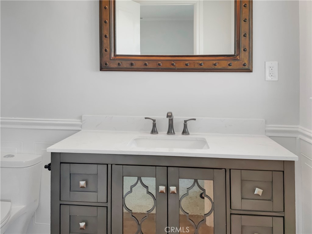6376 Westview Drive Riverside, CA 92506 - Photo 18 of 23 a bathroom with a sink and a mirror