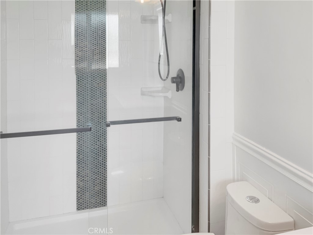 6376 Westview Drive Riverside, CA 92506 - Photo 19 of 23 a bathroom with a shower and a toilet