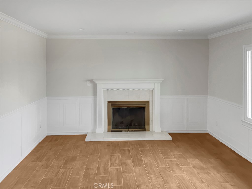 6376 Westview Drive Riverside, CA 92506 - Photo 3 of 23 a view of an empty room with a fireplace and a window